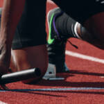 sports athlete at starting line, braced to run