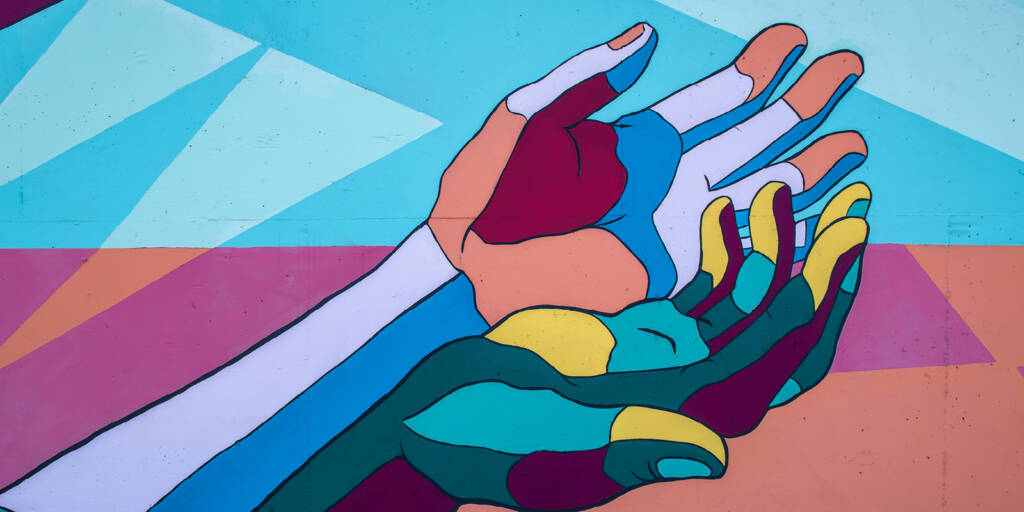 Painted mural of hands in block colours